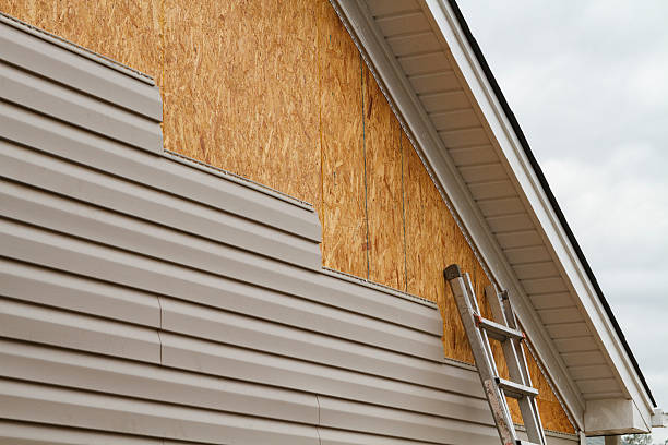 Professional Siding technician working in Somerset, MD